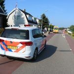 Botsing fietsster en scooterrijder