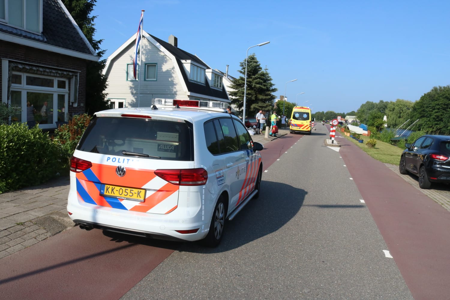 Botsing fietsster en scooterrijder